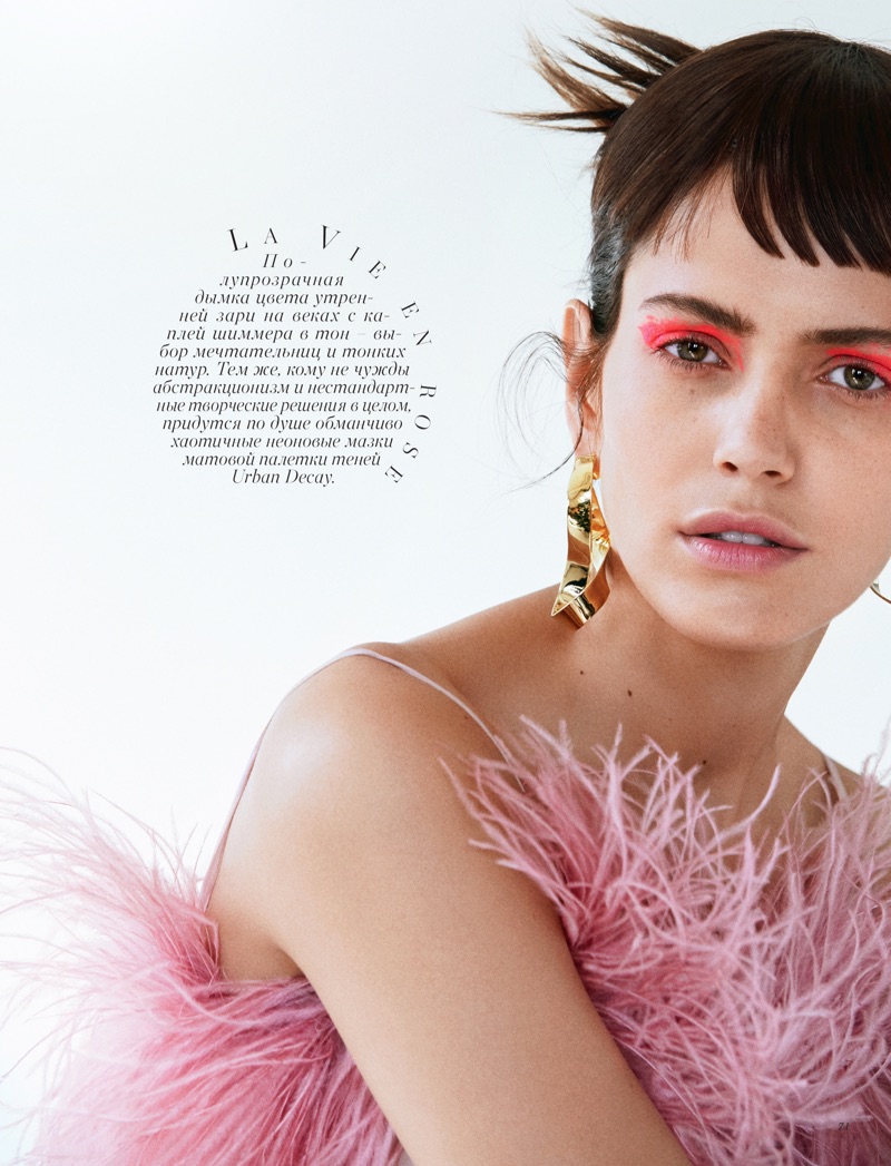 Looking pretty in pink, Amanda Wellsh poses in Prada feathered top with Jennifer Fisher earrings