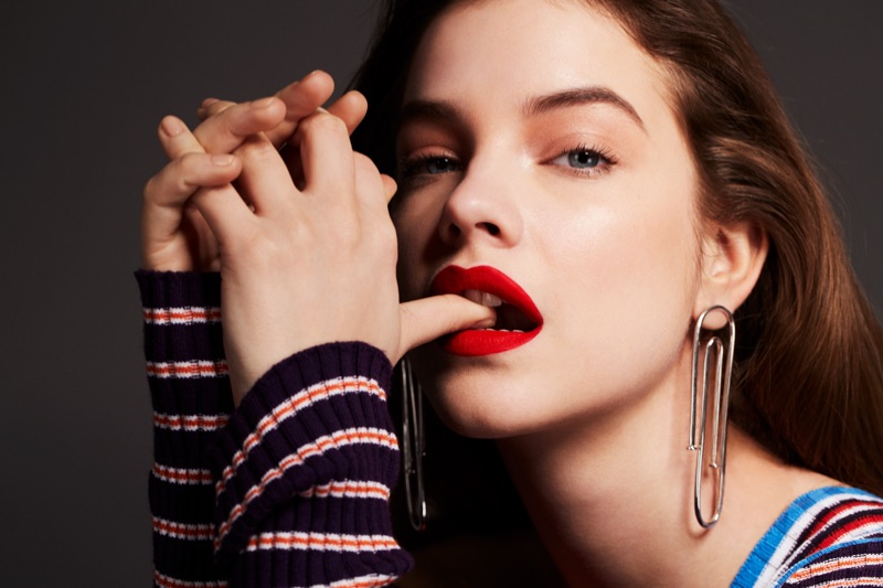 Wearing a bold red lip color, Barbara Palvin models MSGM dress and Jennifer Fisher earrings