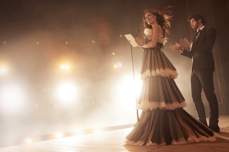 Presenting on stage, Bianca Balti models Gucci gown with tiered ruffles