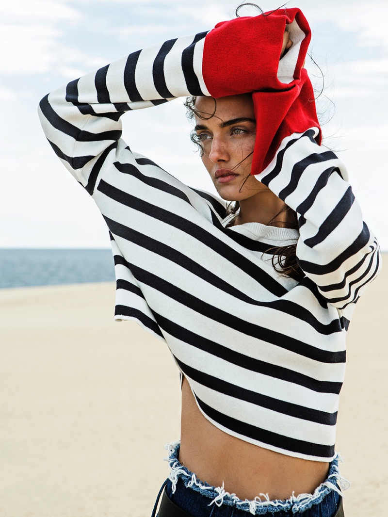 Photographed by Adler & Fresneda, Blanca Padilla poses in striped sweater from Stradivarius