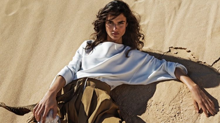 Posing in the desert, Blanca Padilla models Stradivarius long-sleeve shirt and paper bag waist skirt