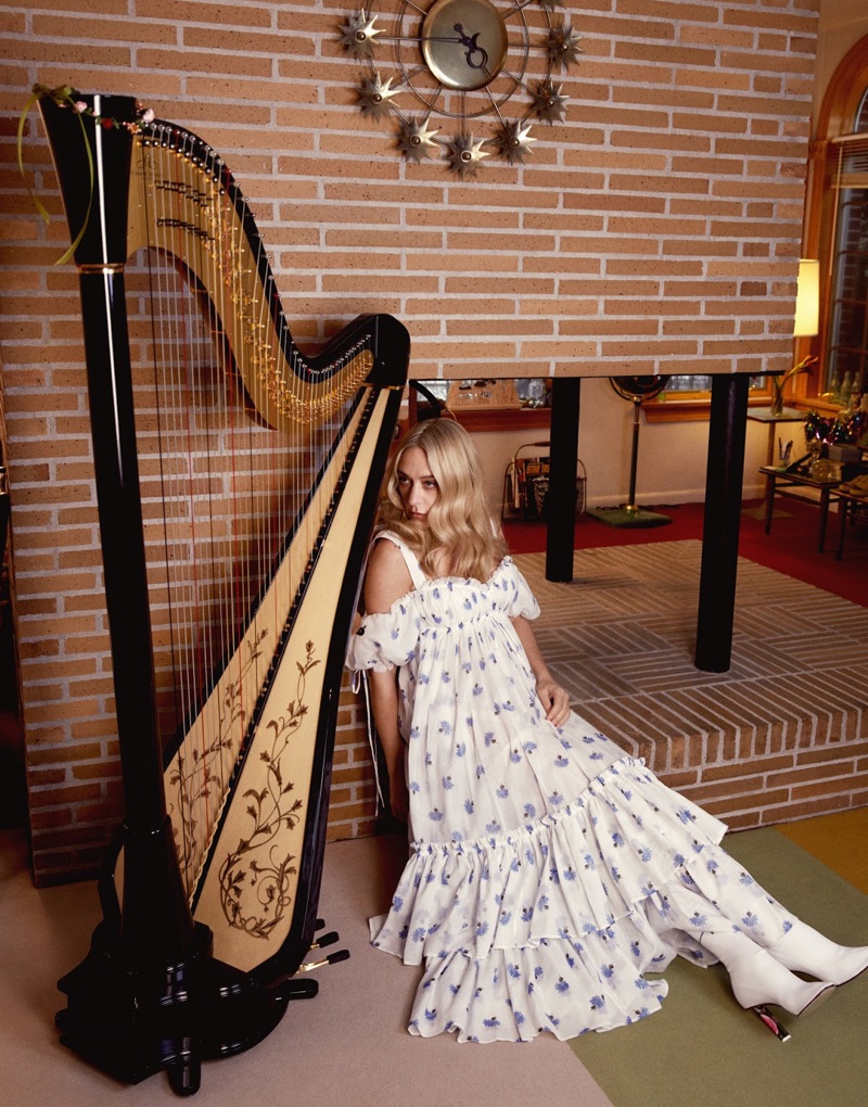 Posing next to a harp, Chloe Sevigny models Alexander McQueen dress and Vetements boots