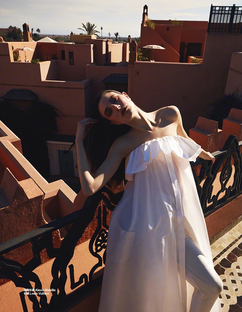 Dressed in white, Jacquelyn Jablonski wears Alexis Mabille sleeveless dress and Louis Vuitton trousers