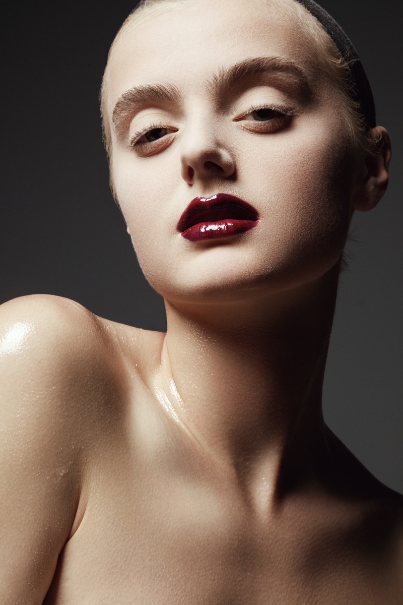 Carley Blayney tries on a dark lip color. Photo: Jeff Tse