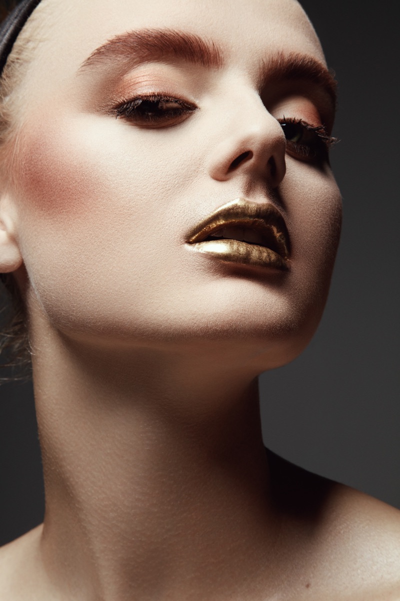 Carley Blayney tries on a metallic lip shade. Photo: Jeff Tse