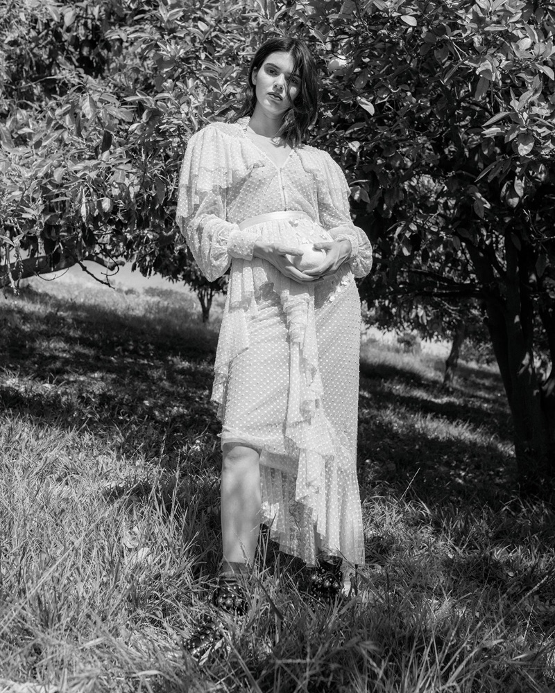 Photographed in black and white, Kendall Jenner models ruffled dress with pleating