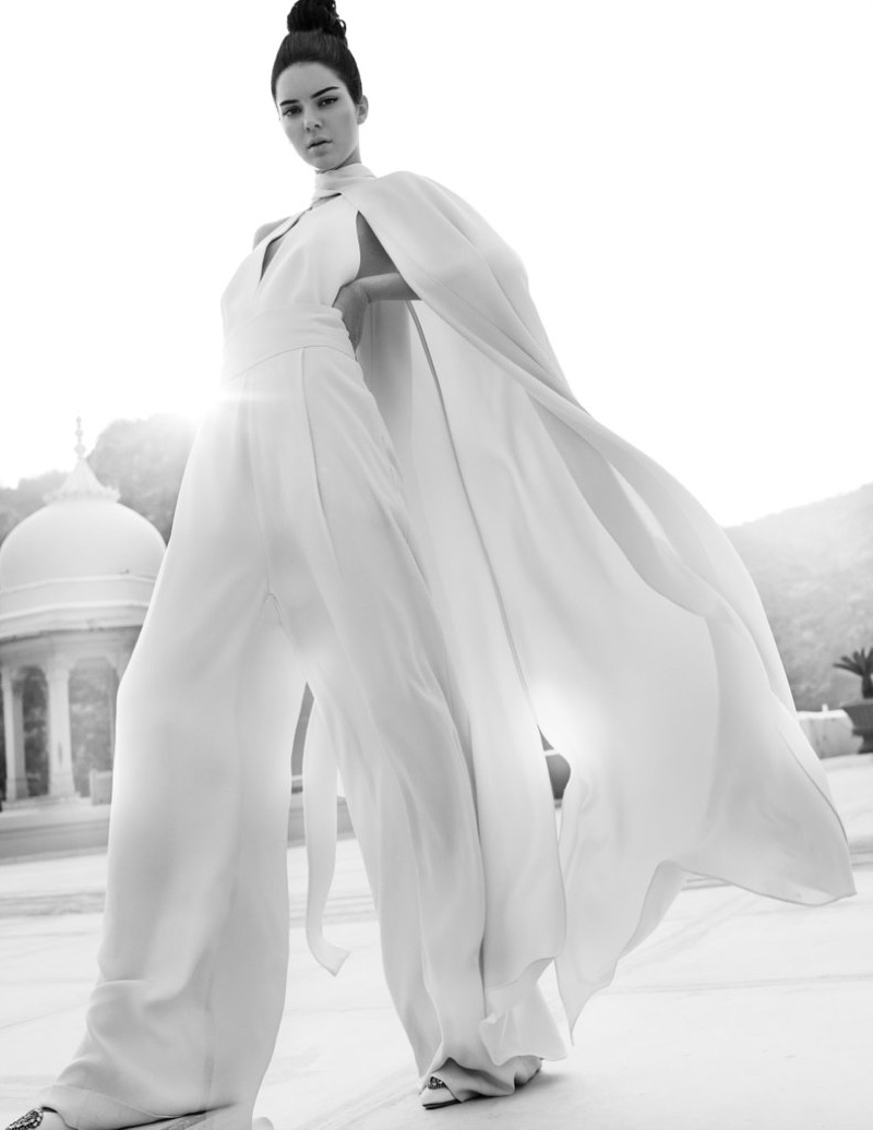 Captured in black and white, Kendall Jenner models white jumpsuit with full cape