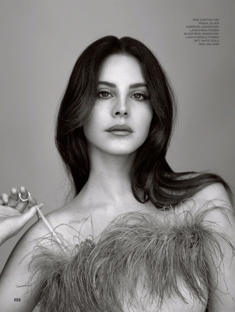 Getting her closeup, Lana Del Rey wears Prada pink chiffon top with feathers