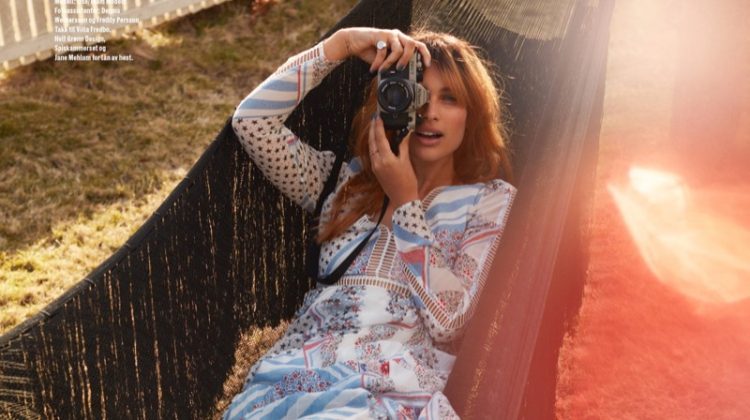 Posing in a hammock, Lise Olsen wears Tommy Hilfiger dress and Converse sneakers