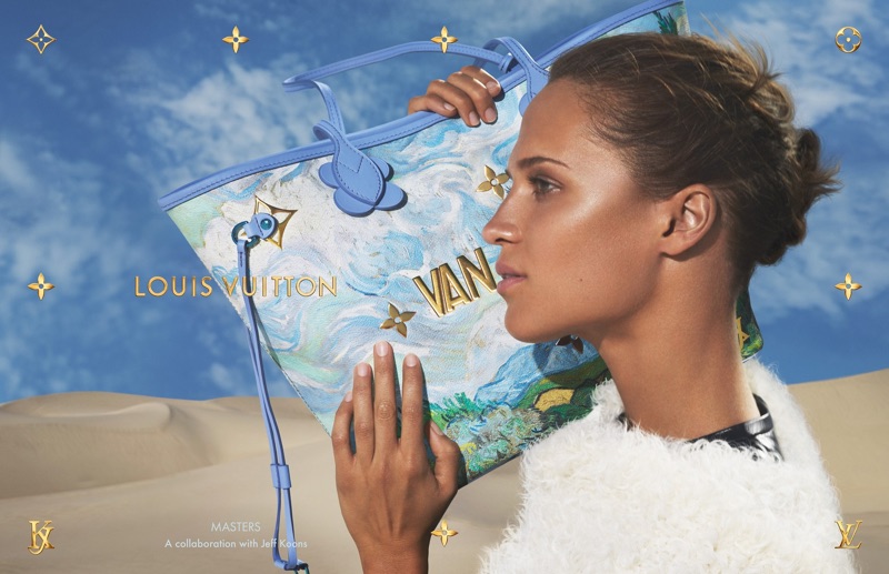 Posing with a Louis Vuitton x Jeff Koons handbag, Alicia Vikander shows off her side profile