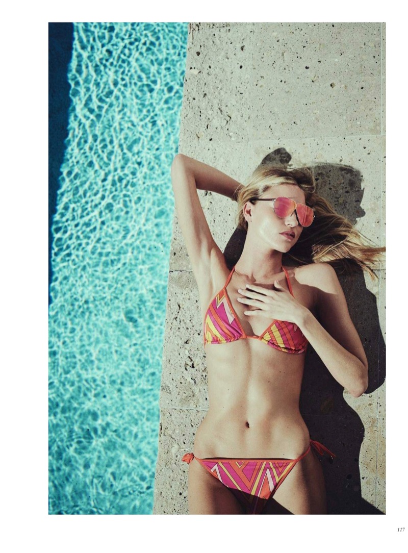 Soaking up the sun, Martha Hunt models M Missoni triangle bikini top and bottoms with 3.1 Phillip Lim x Linda Farrow sunglasses