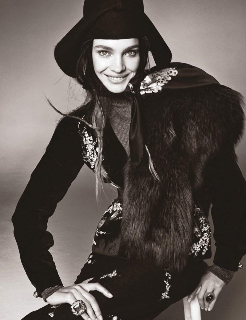 Flashing a smile, Natalia Vodianova poses in No. 21 top, skirt and peplum with Gucci hat and Tory Burch turtleneck