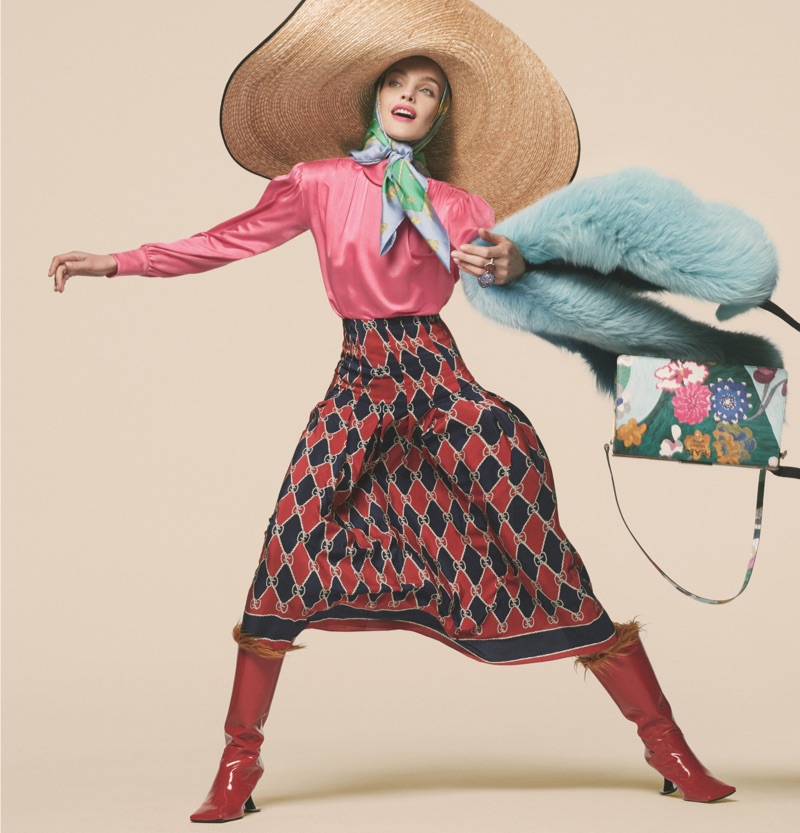 Making moves, Natalia Vodianova wears Gucci blouse, skirt and hat with Marni boots and Prada bag