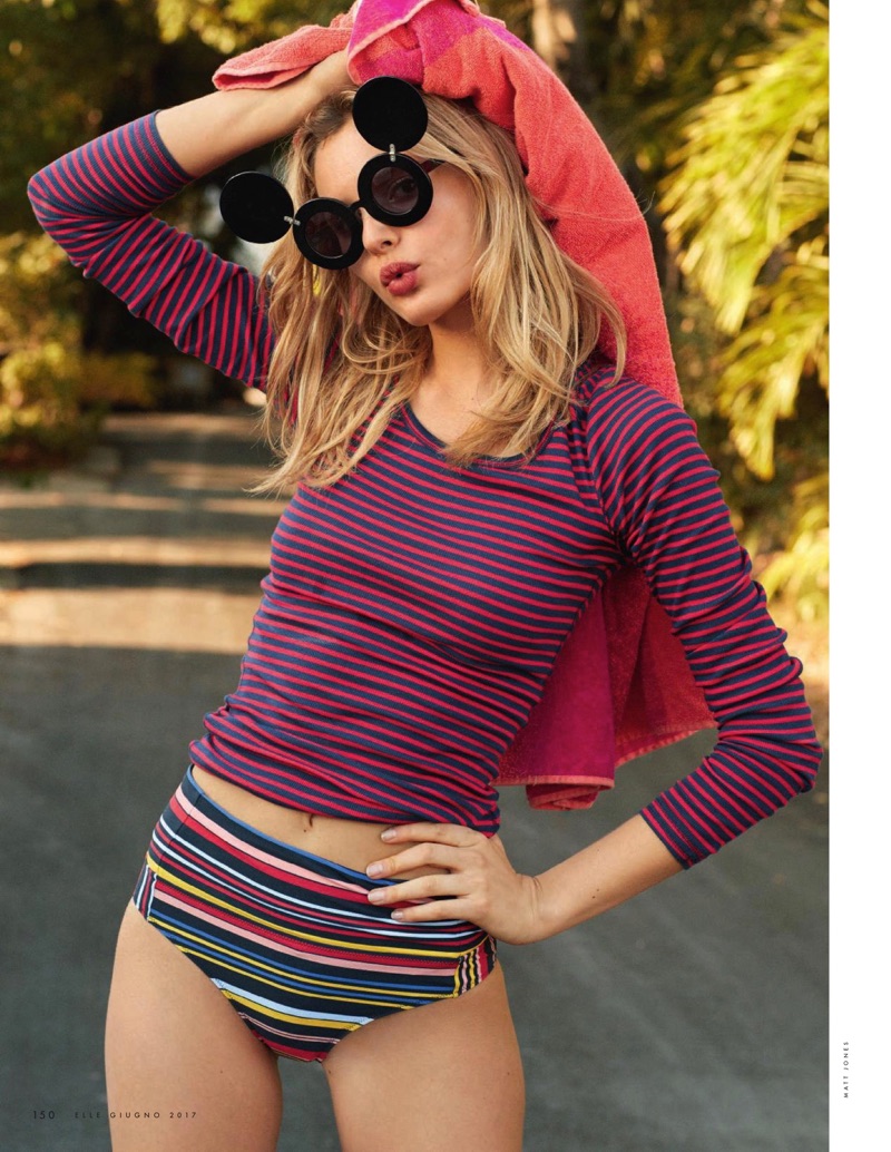 Paige Reifler models Hilfiger Denim long sleeve sweater, Stella McCartney heels and Jeremy Scott x Linda Farrow sunglasses