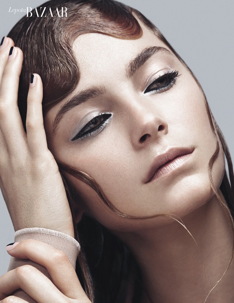 Model Bridget Malcolm poses in sleek beauty looks for the editorial