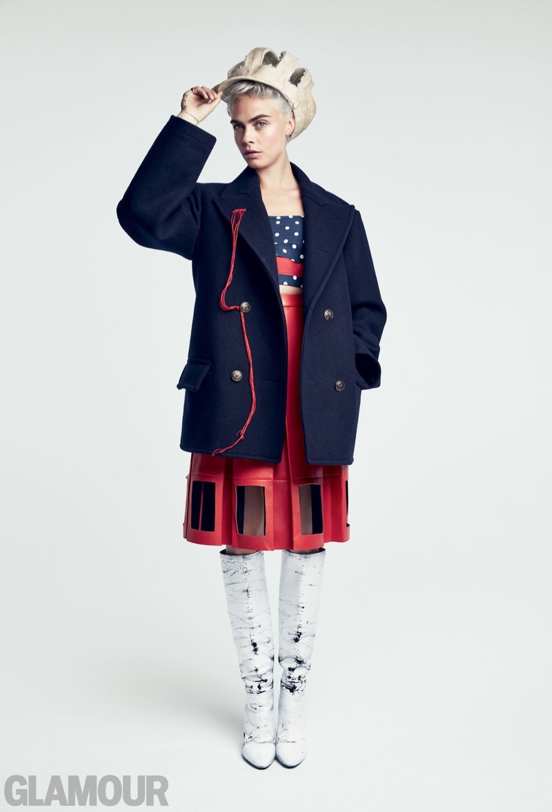 Model and actress Cara Delevingne poses in Maison Margiela peacoat, top, skirt, hat and boots