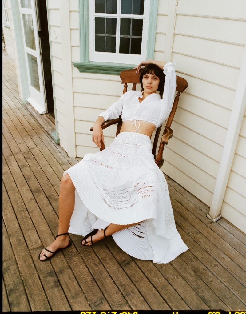 Charlee Fraser wears Alaia cotton-poplin shirt, Alaia cotton maxi skirt and Ancient Greek Sandals leather sandals