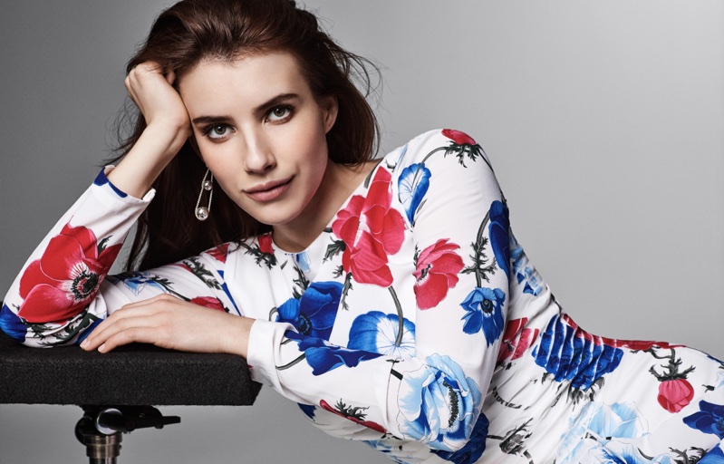 Actress Emma Roberts poses in floral print dress from Salvatore Ferragamo with Tiffany & Co. earrings