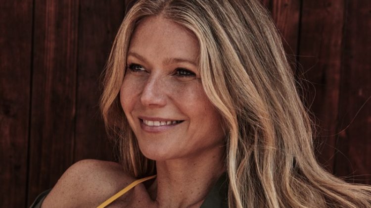 Flashing a smile, Gwyneth Paltrow wears The Green shirt and Eres bikini