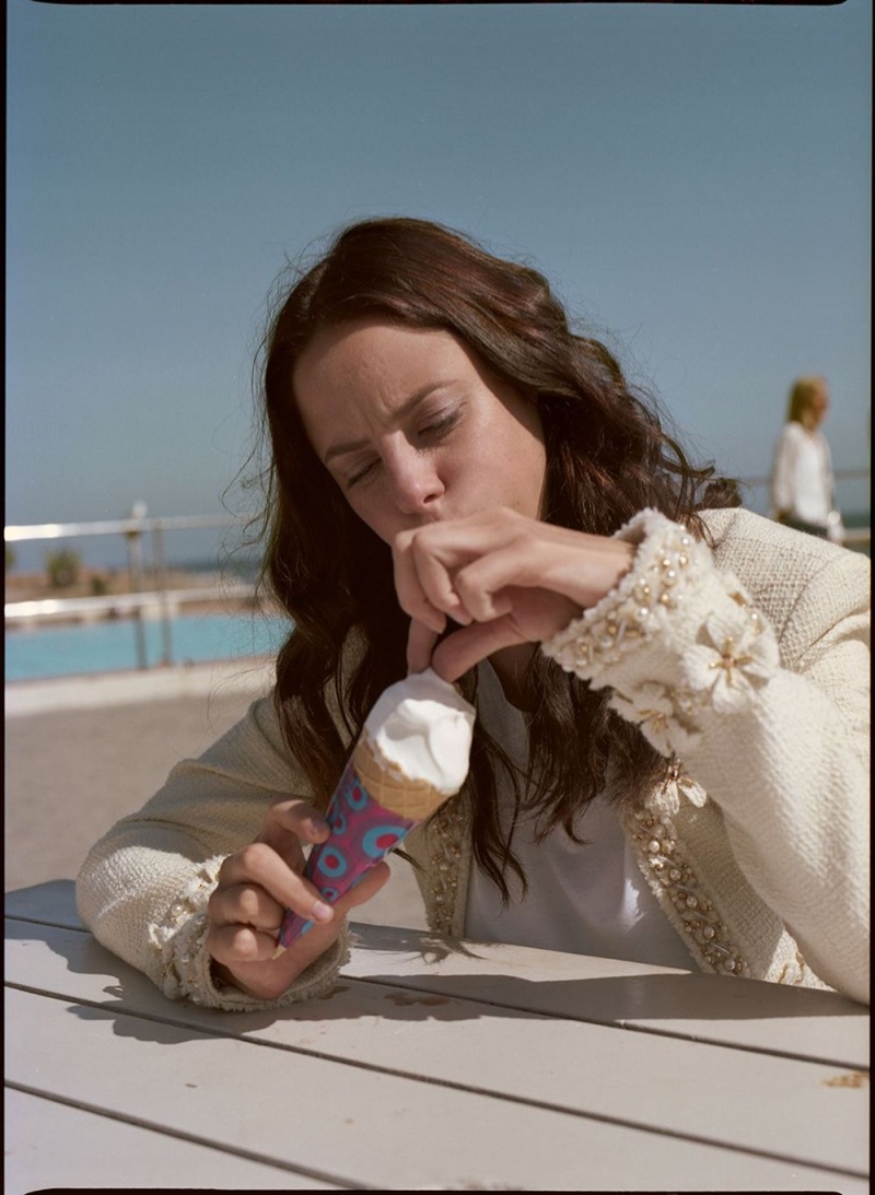 Posing with ice cream, Kaya Scodelario wears a Chanel tweed jacket