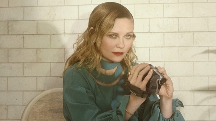 Kirsten Dunst poses with a camcorder wearing a Fendi blouse and Altuzarra skirt