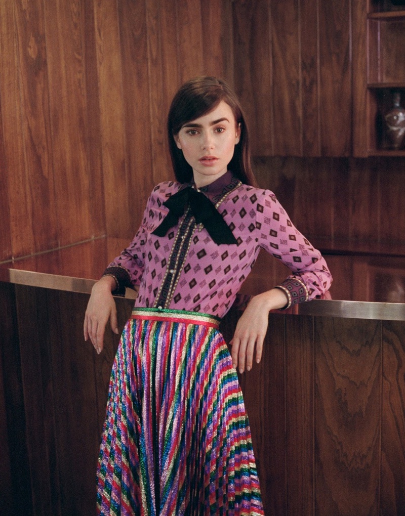 Embracing print, Lily Collins poses in Gucci blouse with Gucci pleated midi skirt