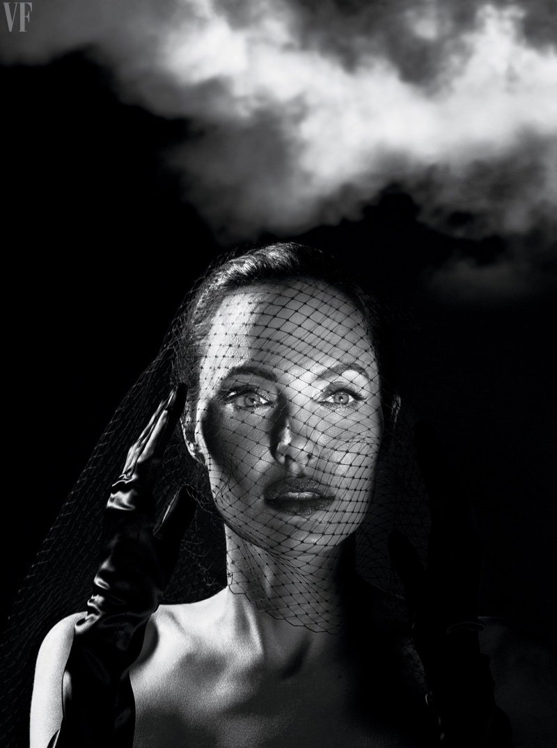 Captured in black and white, Angelina Jolie wears a mesh veil