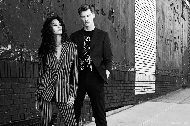 Ziayla wears Joanna Laura Constantine Chain Necklace, Brock Collection Triangle Bra, Missoni Striped Jacket and Pant. James wears Bravado Doors Band Tee, J. Hillburn Suit Jacket and Pants.