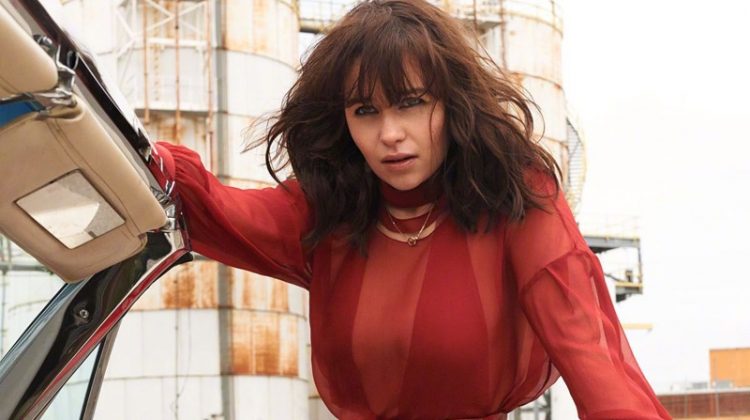 Actress Emilia Clarke poses in a red-hot look for the fashion shoot