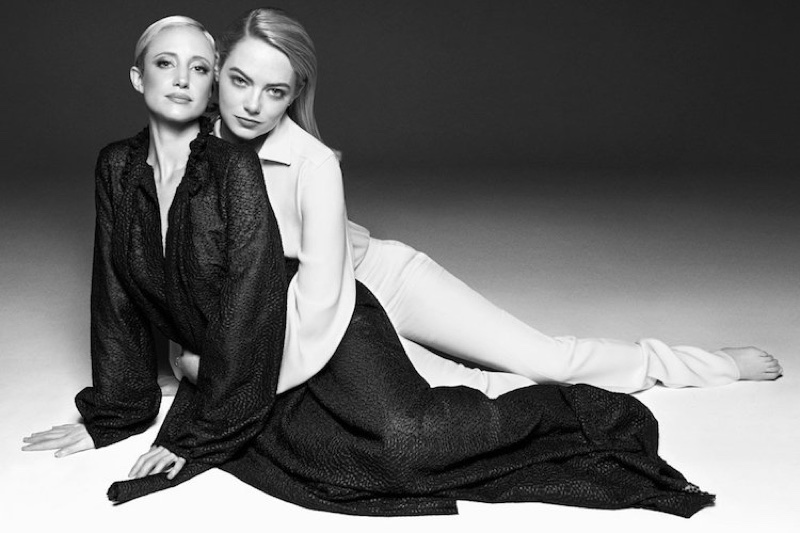 Andrea Riseborough wears Bonnie Young dress. Emma Stone models Tom Ford top and pants with Jennifer Fisher earrings.