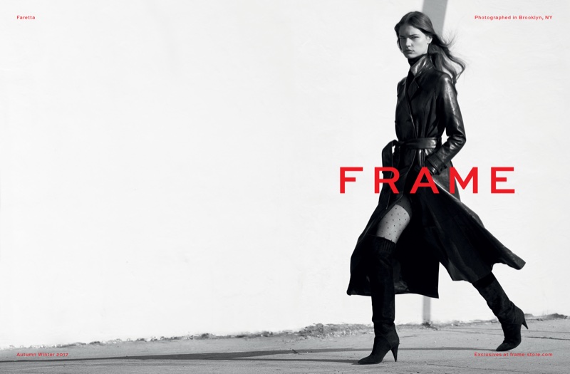 Photographed in black and white, Faretta poses in a leather trench coat from FRAME