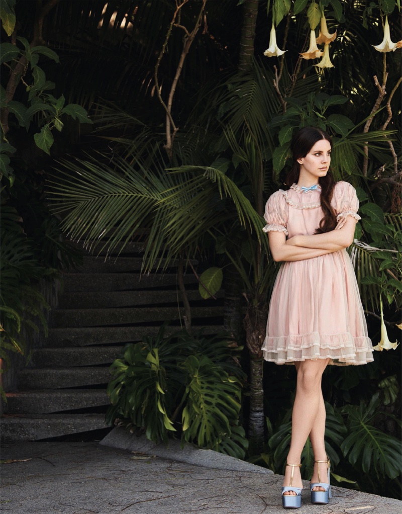 Lana Del Rey looks pretty in pink wearing a babydoll dress with puffed sleeves