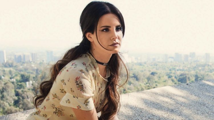 Singer Lana Del Rey poses in floral print dress from Coach
