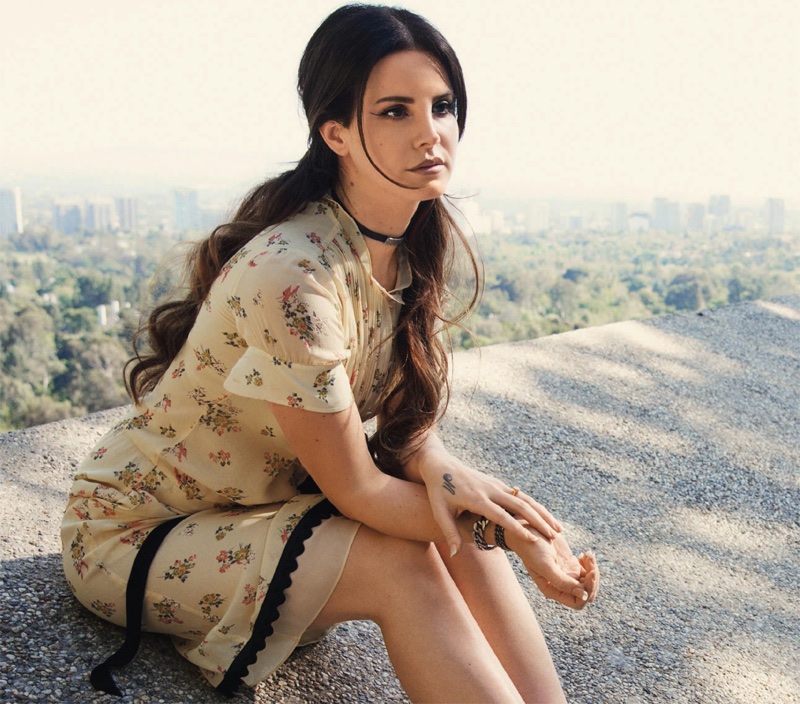 Singer Lana Del Rey poses in floral print dress from Coach