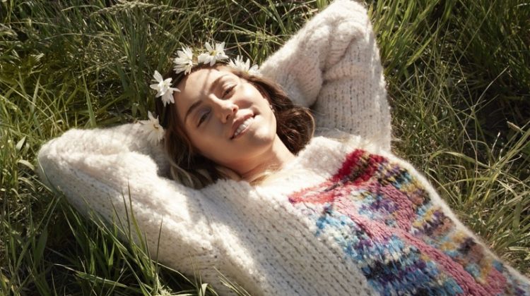 Wearing a flower crown, Miley Cyrus models Missoni sweater