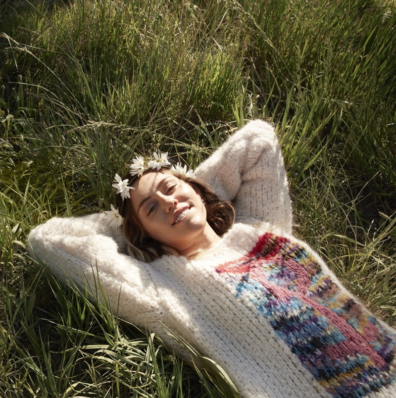 Wearing a flower crown, Miley Cyrus models Missoni sweater