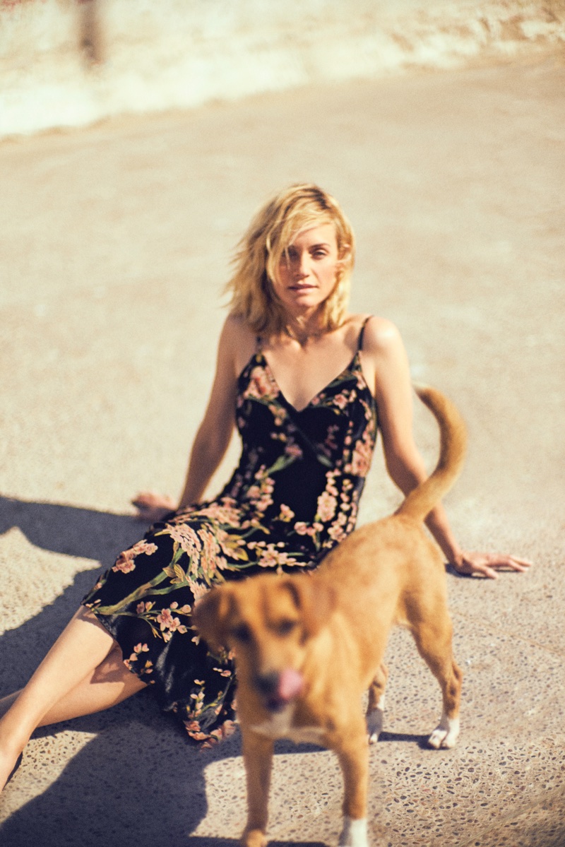 Amber Valletta poses in a floral print dress for Anthropologie’s September 2017 catalog