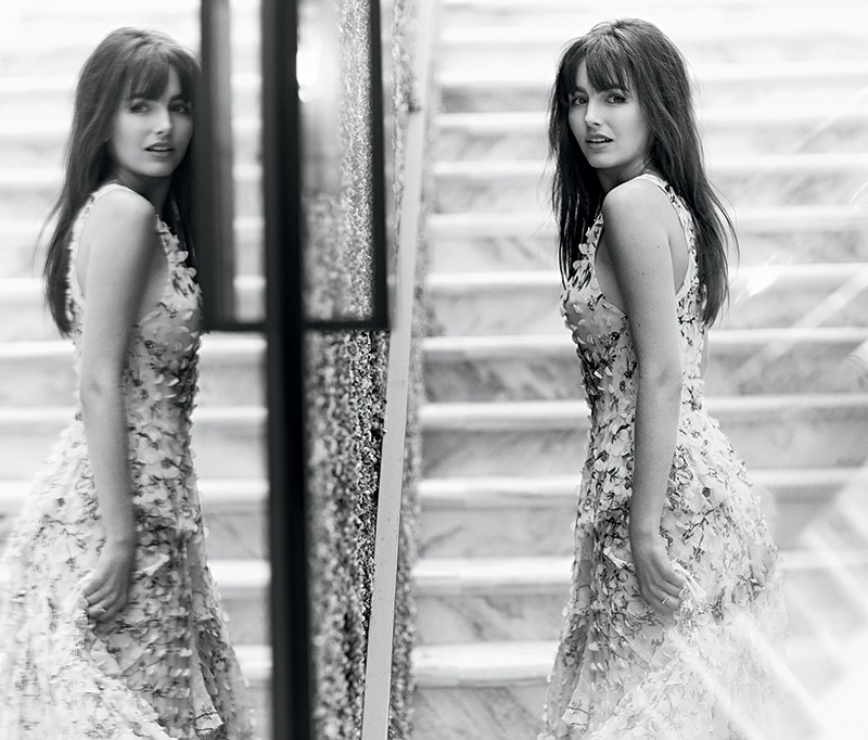 Photographed in black and white, Camilla Belle wears Zimmermann dress