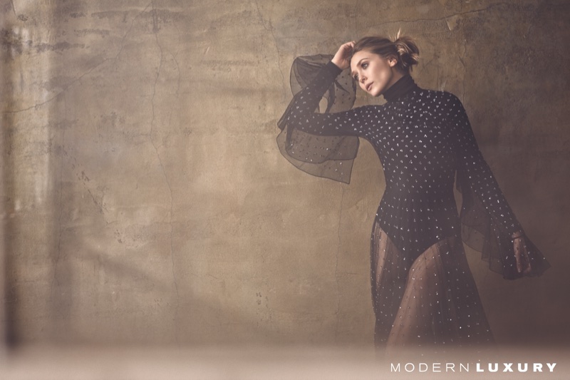 Striking a pose, Elizabeth Olsen models Dior dress with Wolford bodysuit