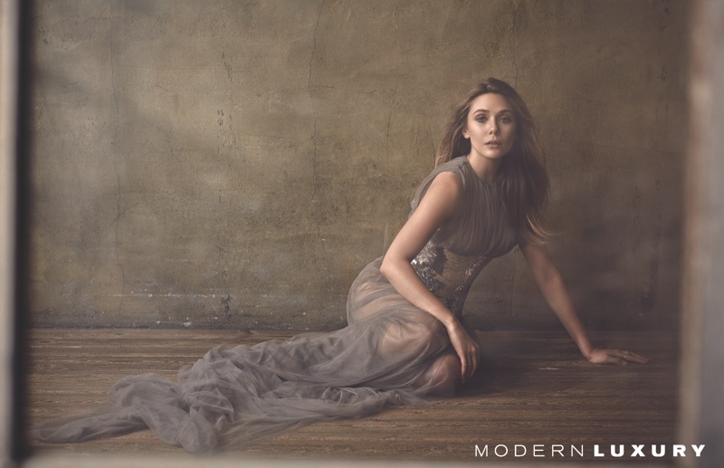 Elizabeth Olsen poses in a Vera Wang gown with Oscar de la Renta corset