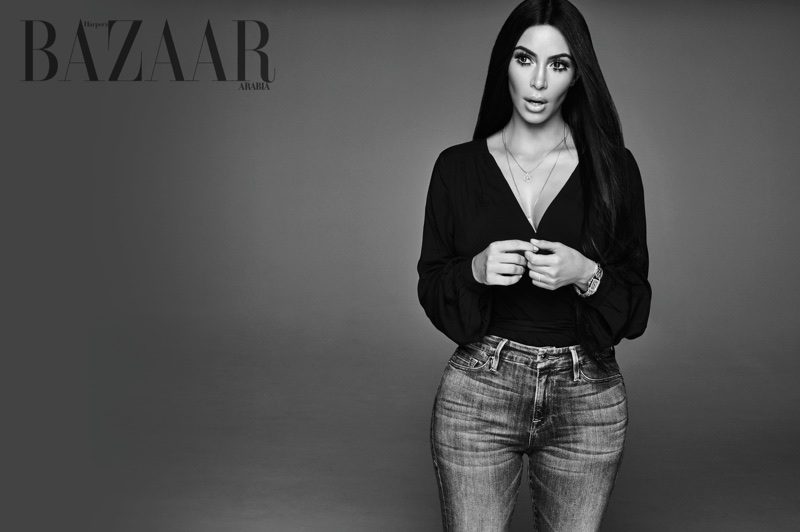 Captured in black and white, Kim Kardashian wears Paige top and Good American jeans