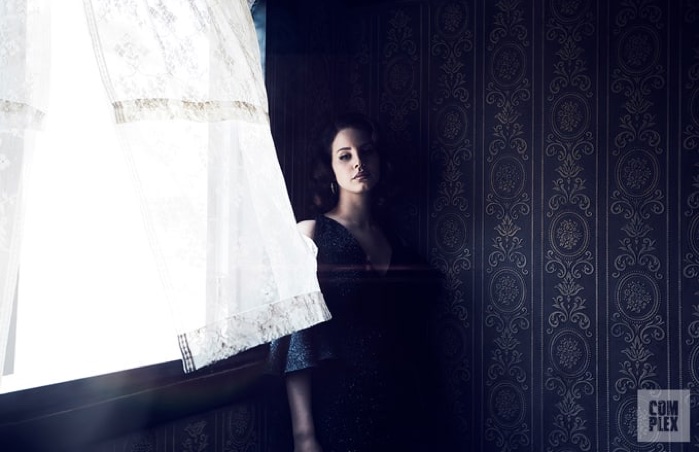 In the shadows, Lana Del Rey wears Maria Lucia Hohan dress