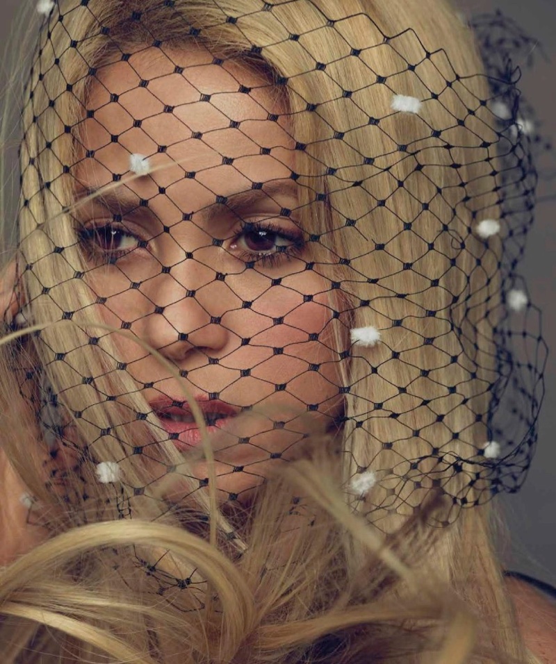 Getting her closeup, Shakira wears a mesh veil