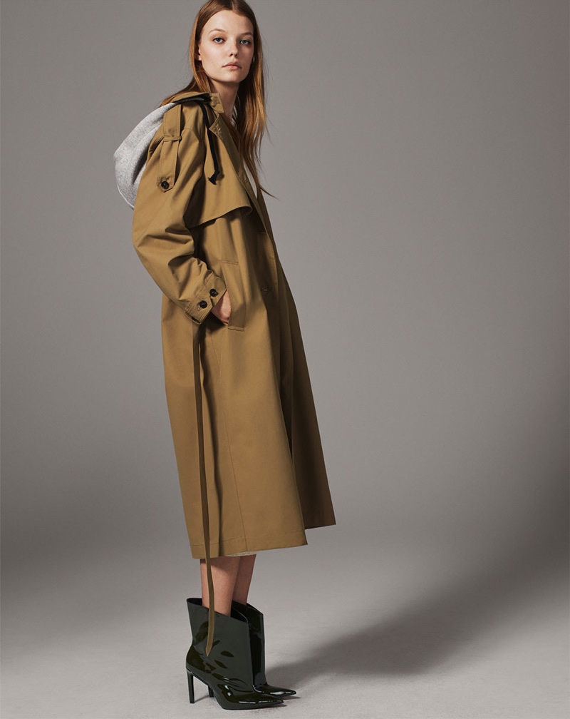 Roos Abels wears Zara trench coat with hood and ankle boots
