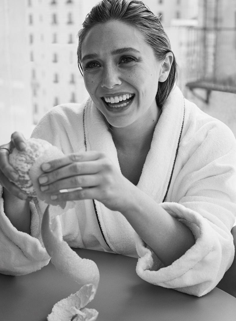 Actress Elizabeth Olsen is all smiles in a robe