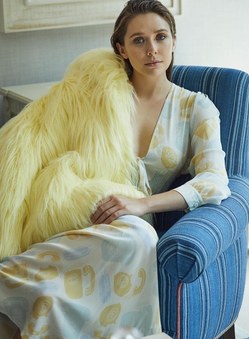 Actress Elizabeth Olsen wears Miu Miu coat and dress