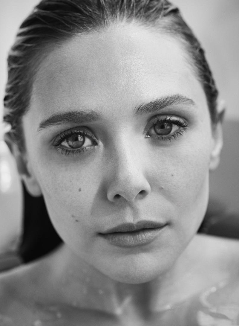 Photographed in black and white, Elizabeth Olsen wears a natural makeup look