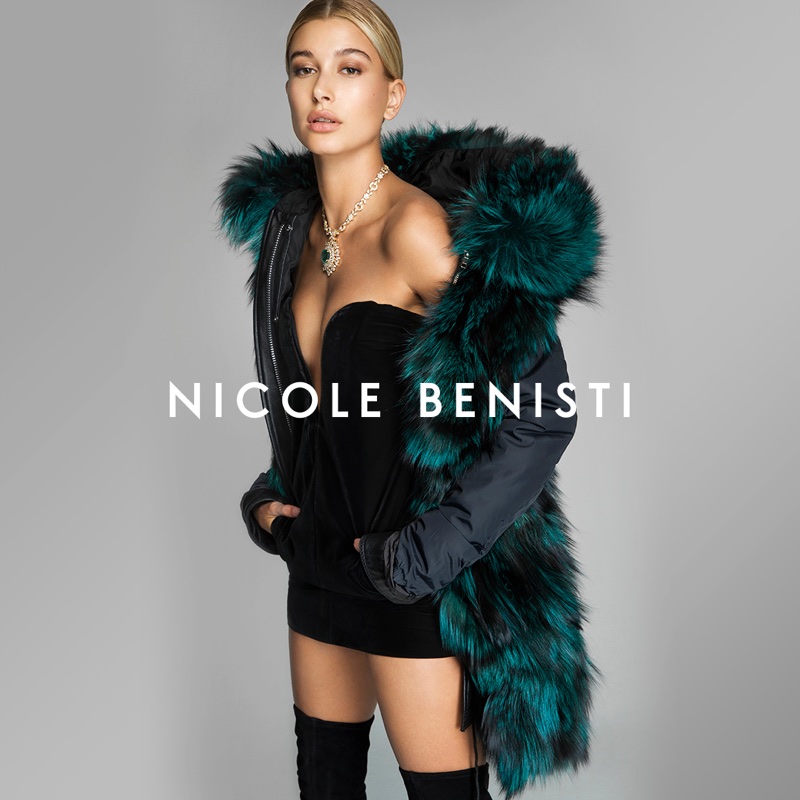 Model Hailey Baldwin poses in little black dress and faux fur in Nicole Benisti's fall-winter 2017 campaign