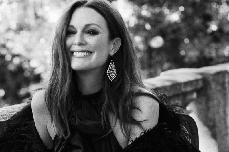 All smiles, Julianne Moore poses in Lanvin coat, Saint Laurent dress and Chopard earrings