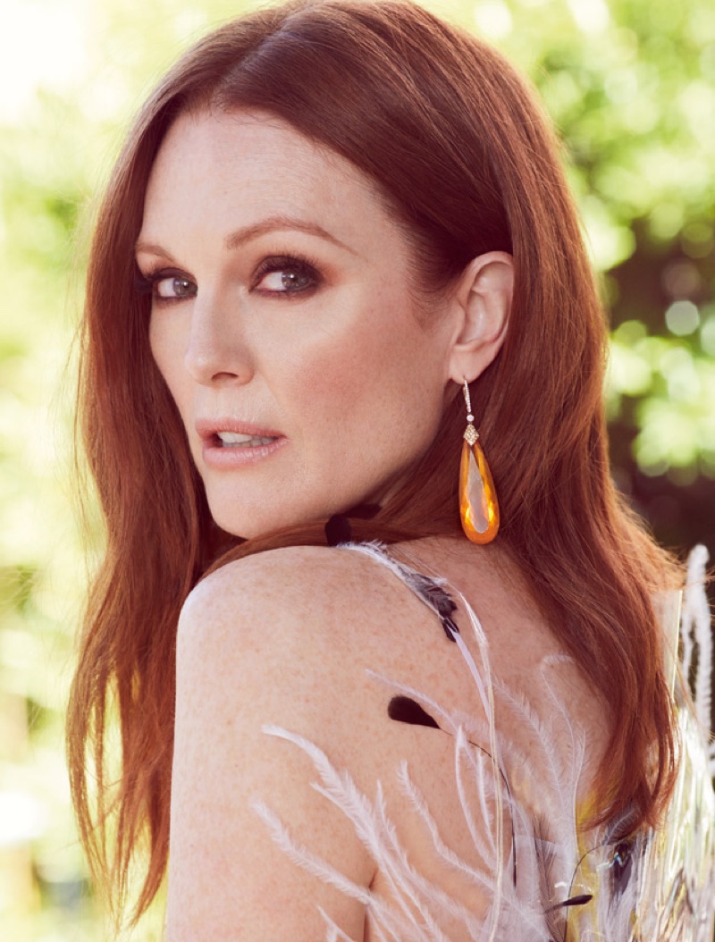 Getting her closeup, Julianne Moore wears Calvin Klein feathered dress and Chopard earrings